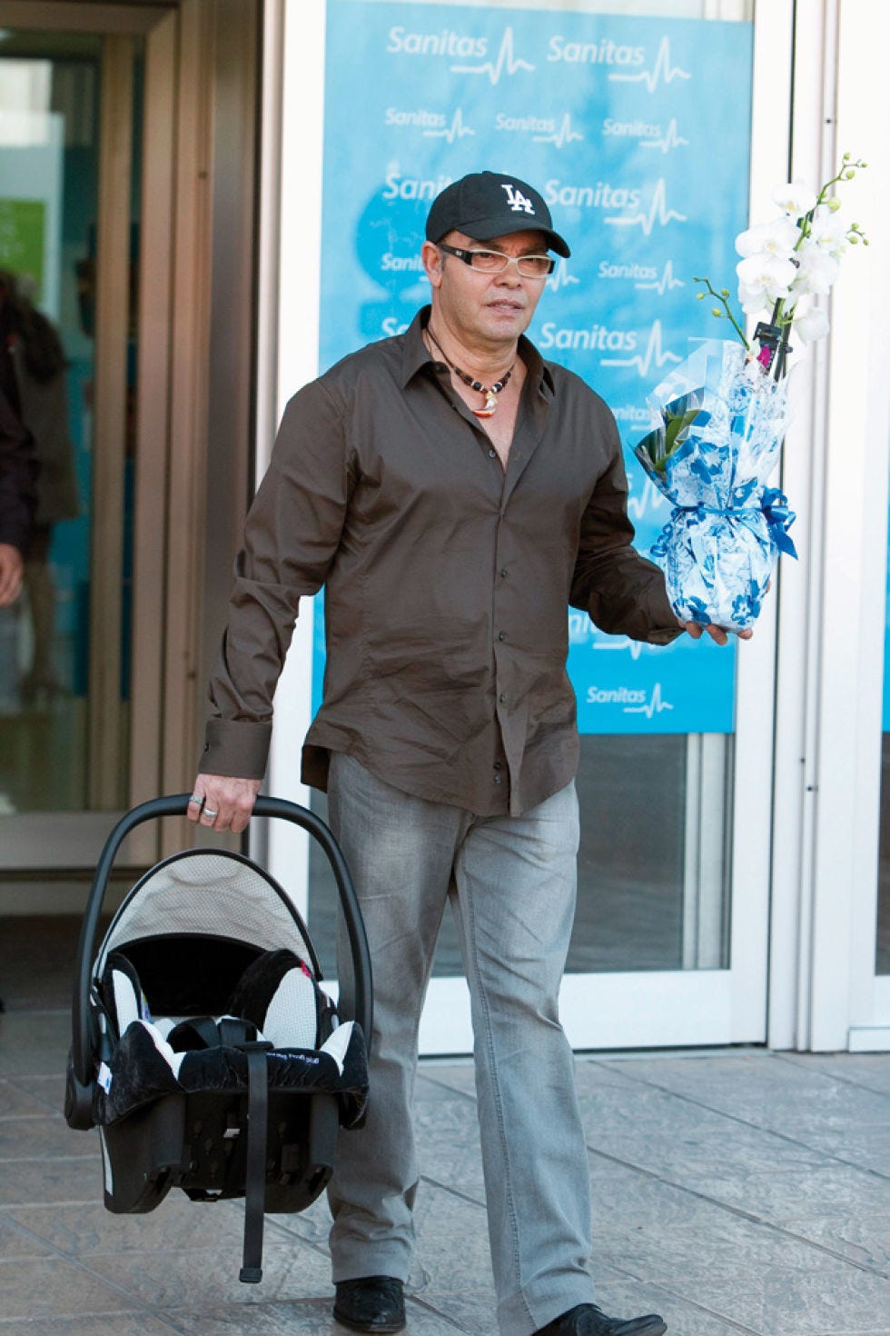 Cap, Shoe, Dress shirt, Door, Suit trousers, Baseball cap, Baby Products, Rolling, Home door, Baggage, 
