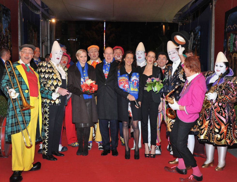 Footwear, Hat, Flooring, Carpet, Headgear, Sun hat, Costume, Fedora, Red carpet, Tradition, 