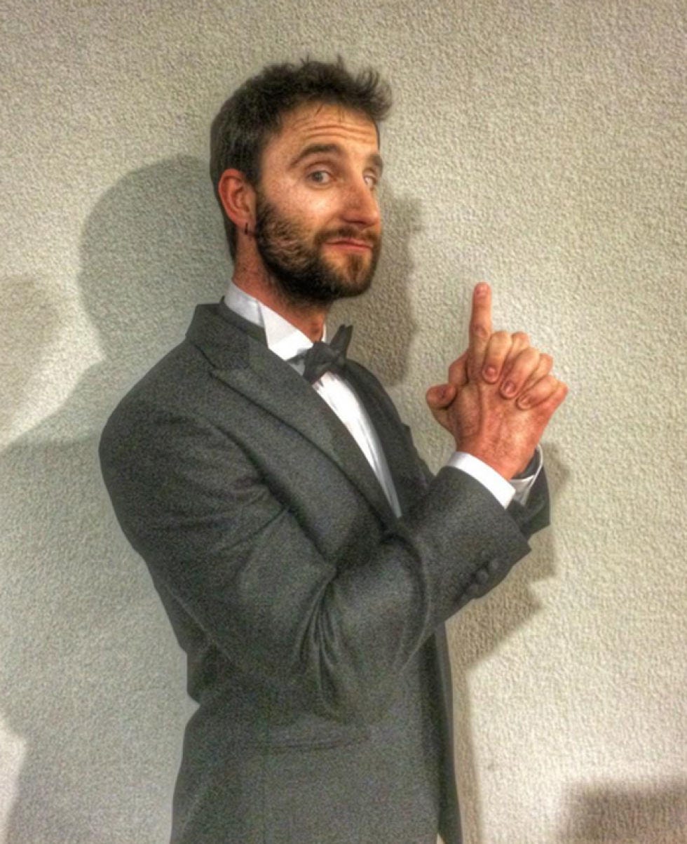 Dress shirt, Coat, Collar, Facial hair, Shirt, Standing, Outerwear, Suit, Formal wear, Beard, 