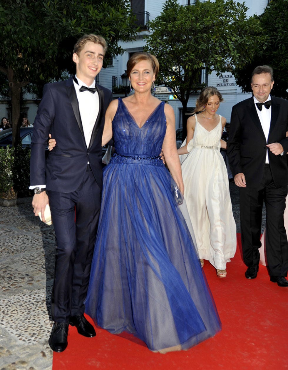 Clothing, Coat, Dress, Event, Trousers, Suit, Flooring, Shirt, Photograph, Outerwear, 