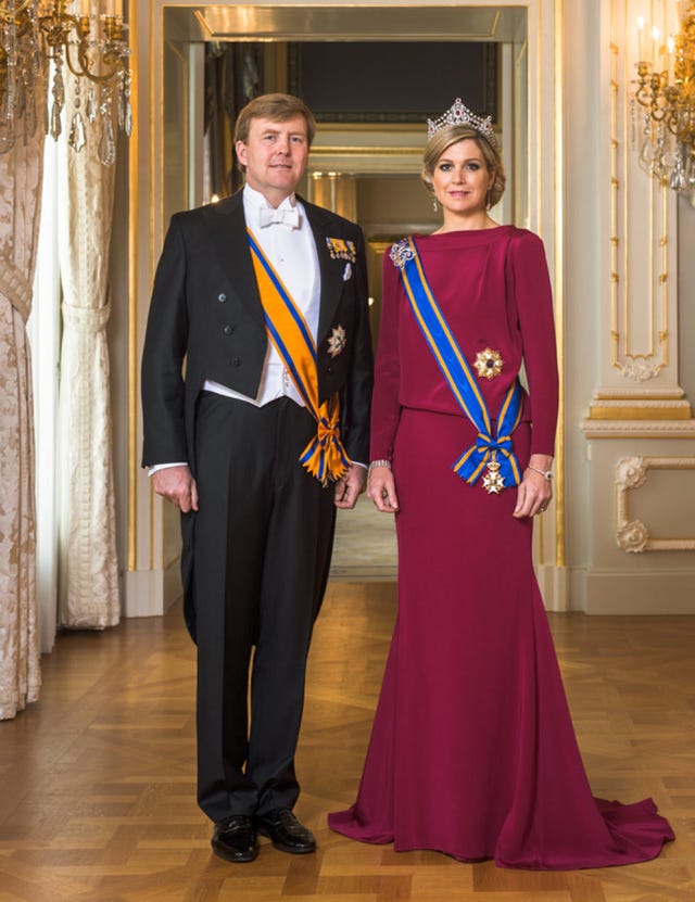 Trousers, Coat, Interior design, Textile, Floor, Outerwear, Flooring, Formal wear, Dress, Interior design, 