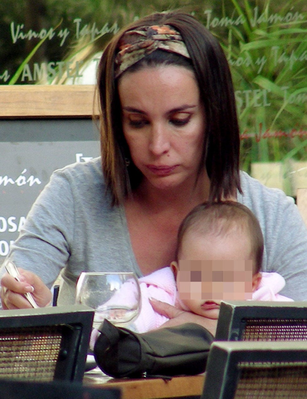 Sitting, Comfort, Long hair, Brown hair, Baby, Blackboard, Headpiece, Hair accessory, Wine glass, Headband, 