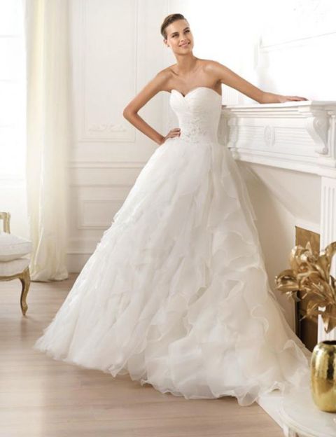 Clothing, Bridal clothing, Sleeve, Shoulder, Dress, Textile, Photograph, Gown, Joint, White, 