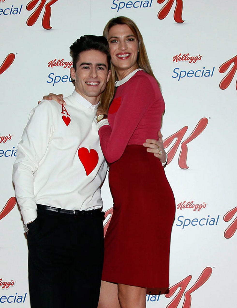 Sleeve, Red, Dress, Collar, Facial expression, Logo, Dress shirt, Carmine, Cocktail dress, One-piece garment, 