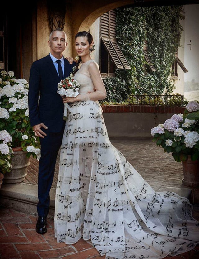 Clothing, Dress, Coat, Trousers, Flowerpot, Petal, Bridal clothing, Photograph, Outerwear, Suit, 