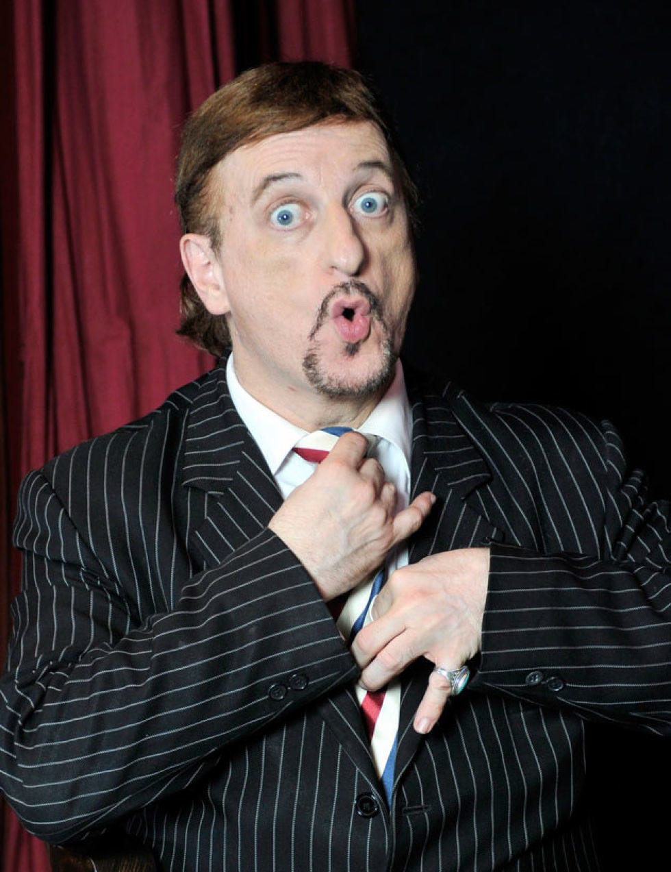 Finger, Dress shirt, Collar, Formal wear, Facial hair, Suit, Curtain, Beard, Blazer, Theater curtain, 
