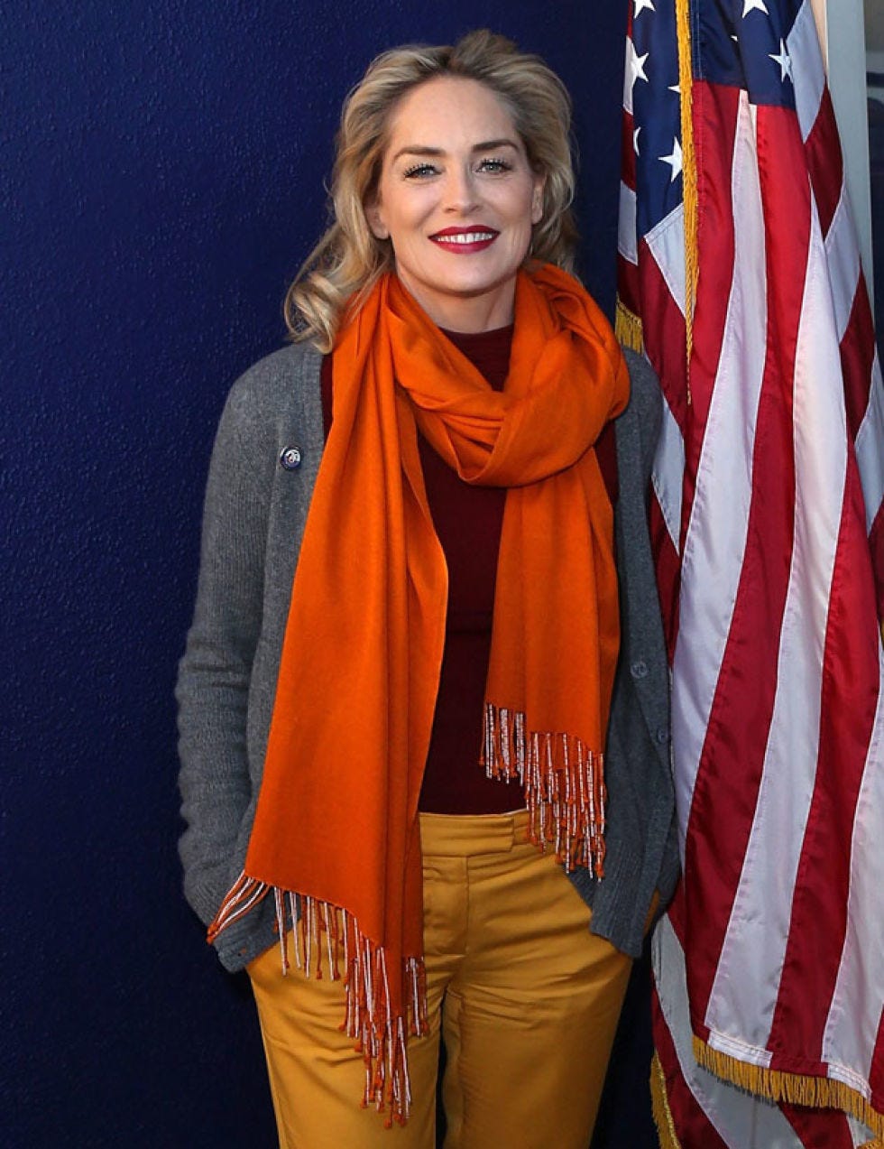 Sleeve, Human body, Flag, Style, Orange, Fashion, Flag of the united states, Stole, Electric blue, Scarf, 