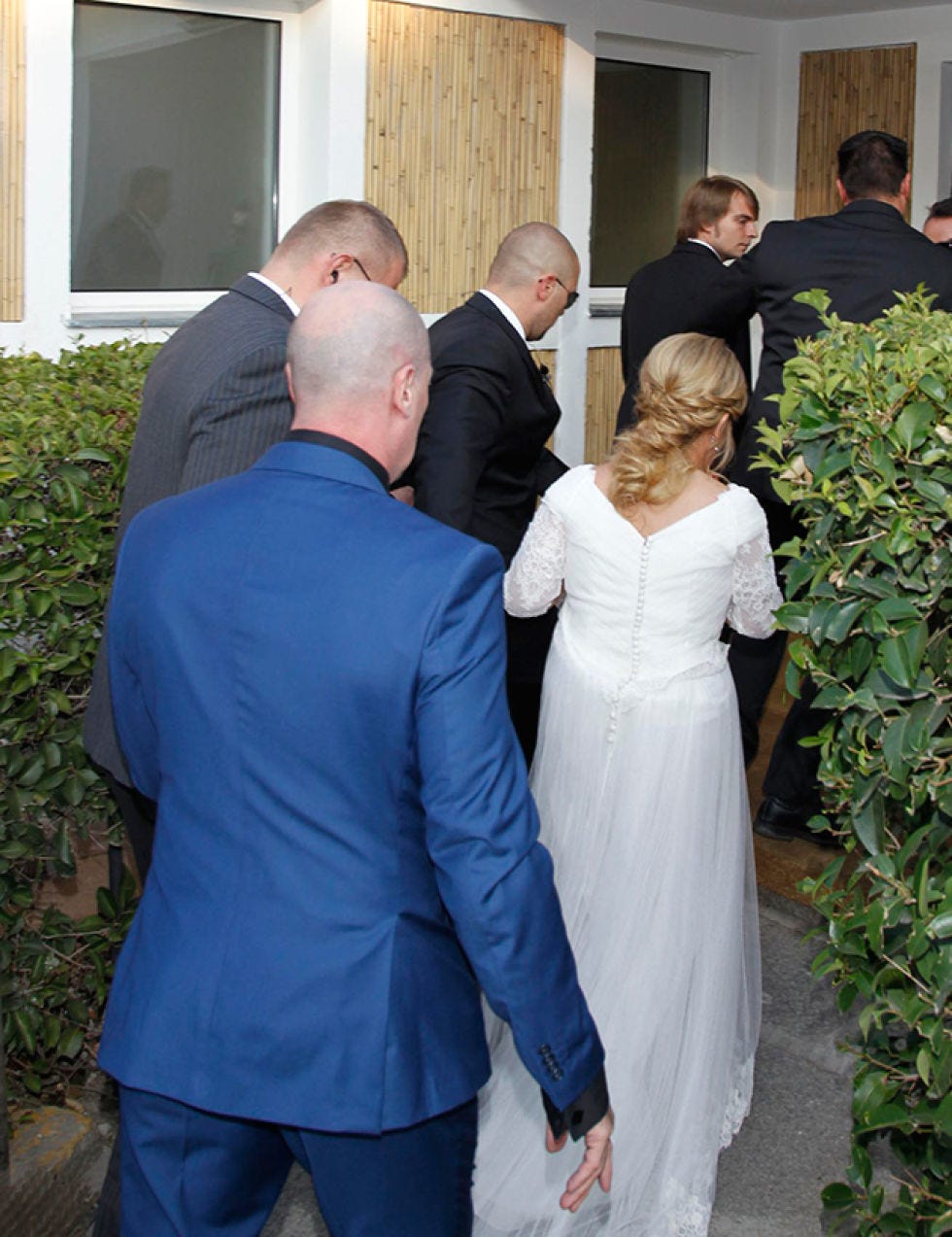 Hair, Trousers, Human body, Coat, Outerwear, Dress, Suit, Formal wear, Interaction, Gown, 