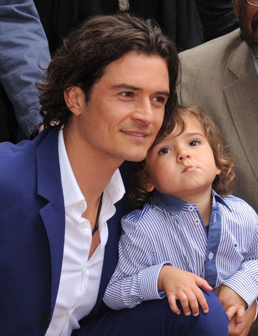 Ear, Hairstyle, Skin, Dress shirt, Collar, Iris, Baby & toddler clothing, Blazer, Love, Button, 