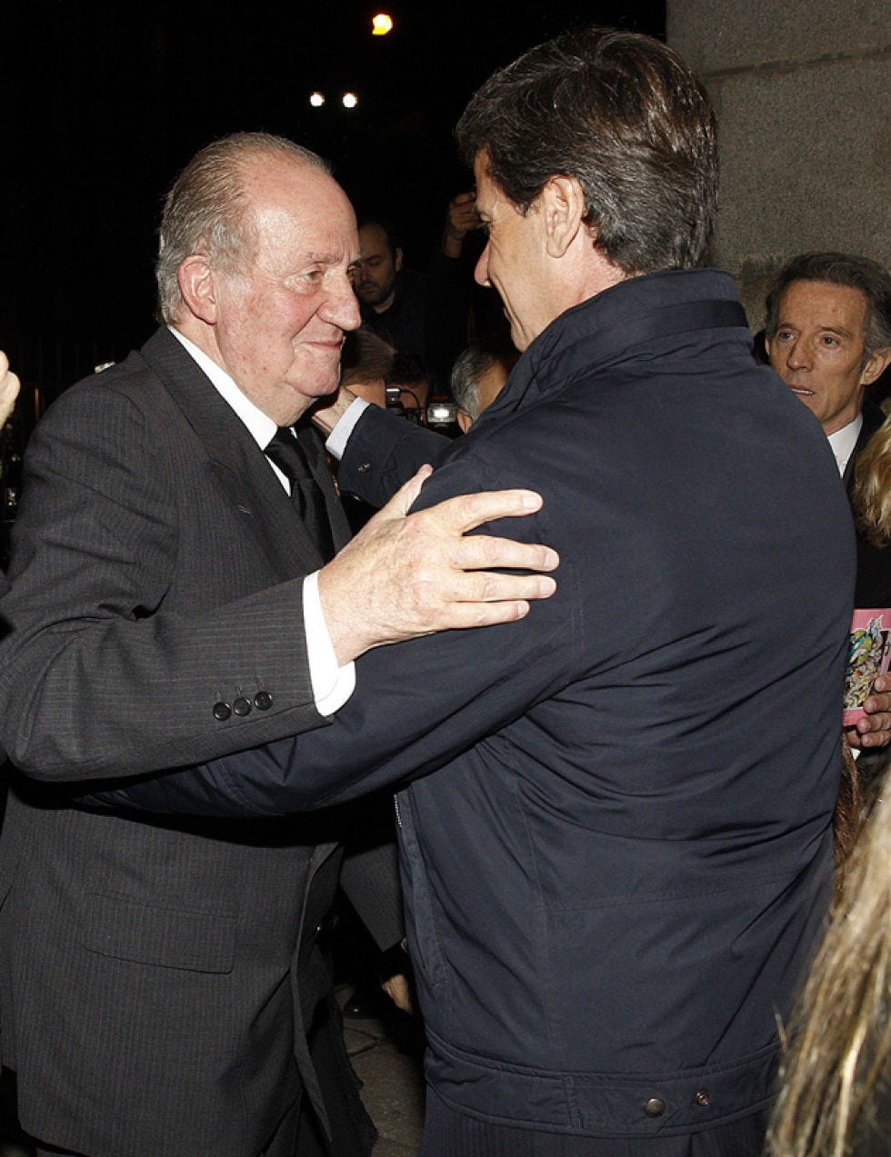 Outerwear, Coat, Suit, Interaction, Greeting, Gesture, Love, Hug, Pocket, 