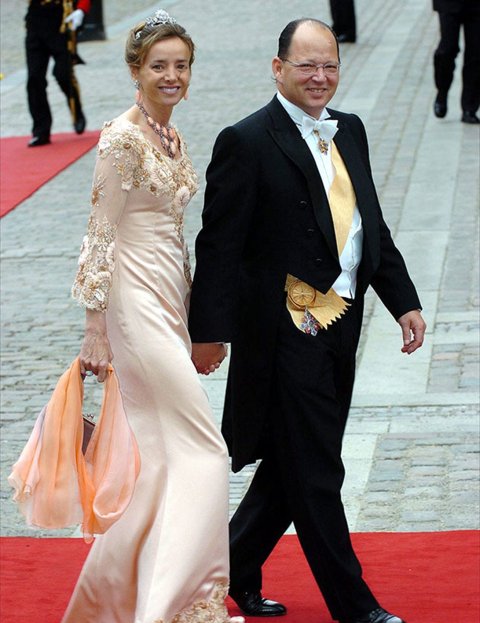 Clothing, Coat, Smile, Trousers, Human body, Dress shirt, Dress, Shirt, Suit, Flooring, 