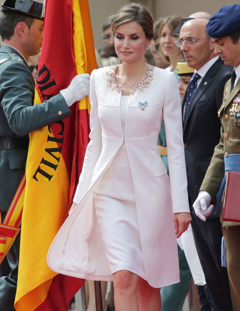 Outerwear, Coat, Dress, Formal wear, Suit, Flag, Fashion accessory, Fashion, One-piece garment, Necklace, 