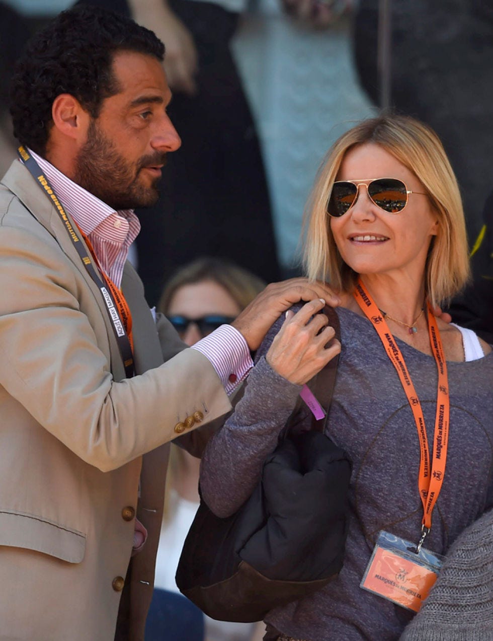 Eyewear, Face, Coat, Outerwear, Sunglasses, Dress shirt, Suit, Wrist, Interaction, Blazer, 