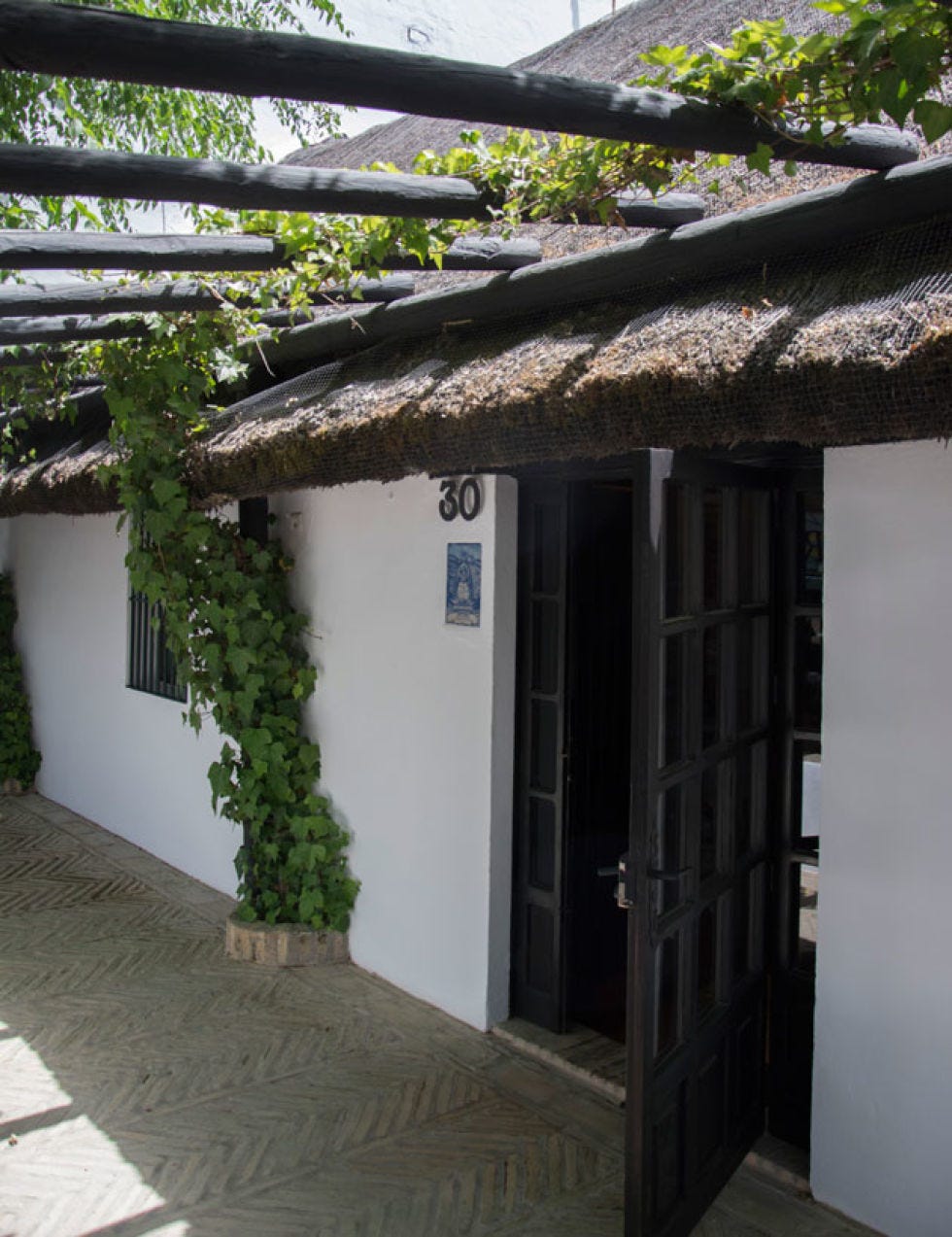 Flooring, Door, House, Roof, Cobblestone, Home door, Shade, Village, Thatching, Flagstone, 