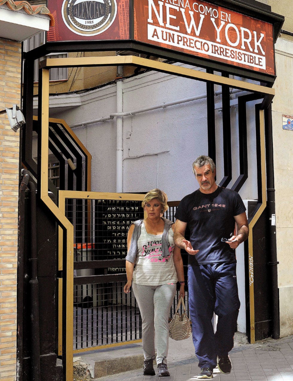 Trousers, Shirt, Outerwear, T-shirt, Street fashion, Jacket, Signage, Iron, Door, Advertising, 