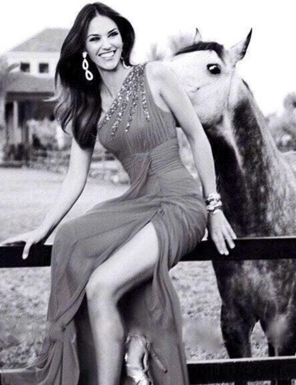 Dress, Photograph, Facial expression, Style, Horse, Working animal, Jewellery, Waist, Horse supplies, One-piece garment, 