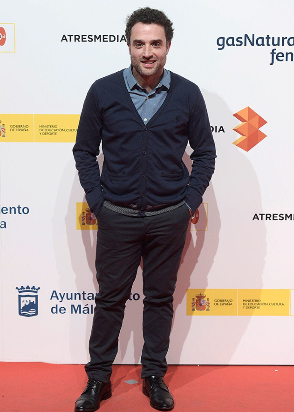 Dress shirt, Sleeve, Collar, Shoe, Style, Premiere, Flooring, Logo, Carpet, Denim, 