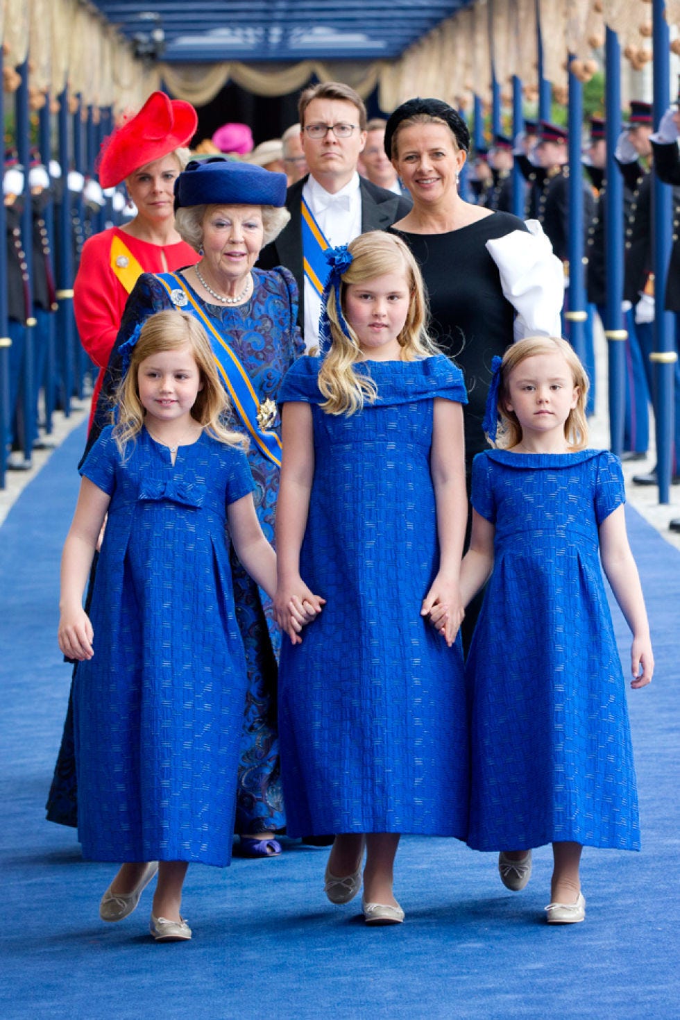 Clothing, Face, Blue, People, Dress, Hat, Standing, Child, One-piece garment, Electric blue, Clothing, Face, Blue, People, Dress, Hat, Standing, Child, One-piece garment, Electric blue,