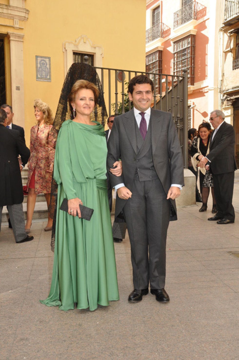 Clothing, Coat, Trousers, Shirt, Standing, Suit, Dress, Outerwear, Suit trousers, Formal wear, 