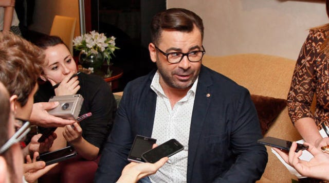 Vision care, Hand, Mobile phone, Gadget, Blazer, Nail, Houseplant, Conversation, Facial hair, Mobile device, 