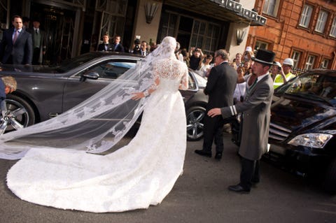 Clothing, Land vehicle, Vehicle, Bridal clothing, Automotive design, Dress, Suit, Car, Coat, Formal wear, 