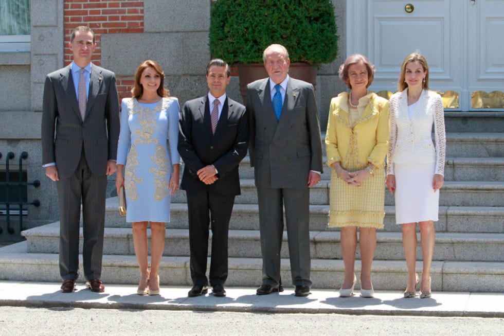 Clothing, Footwear, Coat, Trousers, Suit trousers, Standing, Shirt, Social group, Photograph, Outerwear, 