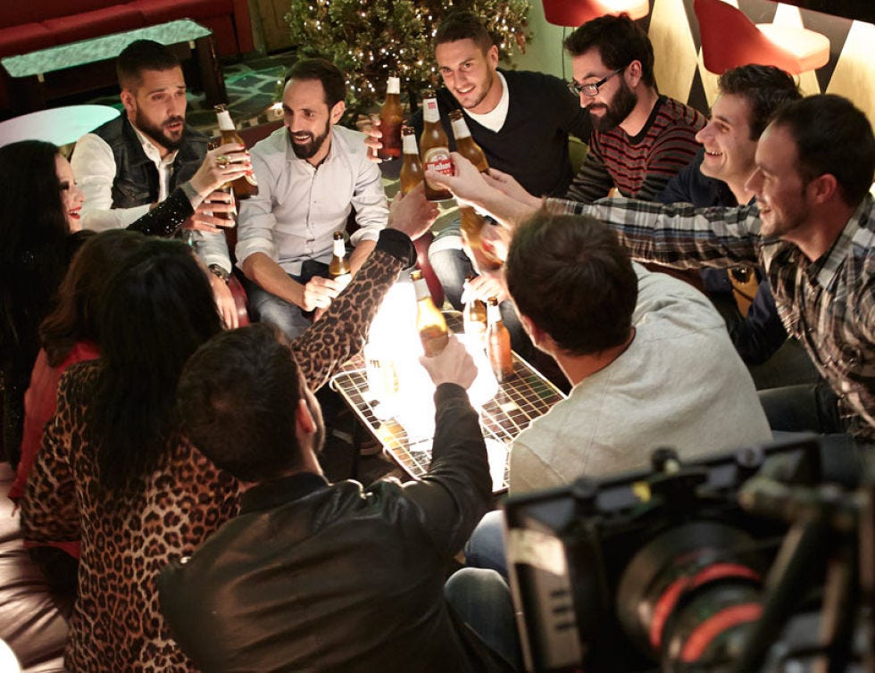 Hat, Sharing, Holiday, Conversation, Alcoholic beverage, Distilled beverage, Barware, Christmas eve, Christmas, Camera lens, 