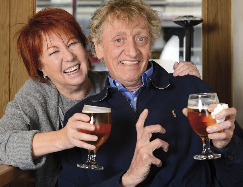 Smile, Drink, Alcoholic beverage, Alcohol, Glass, Barware, Tableware, Hand, Drinkware, Distilled beverage, 