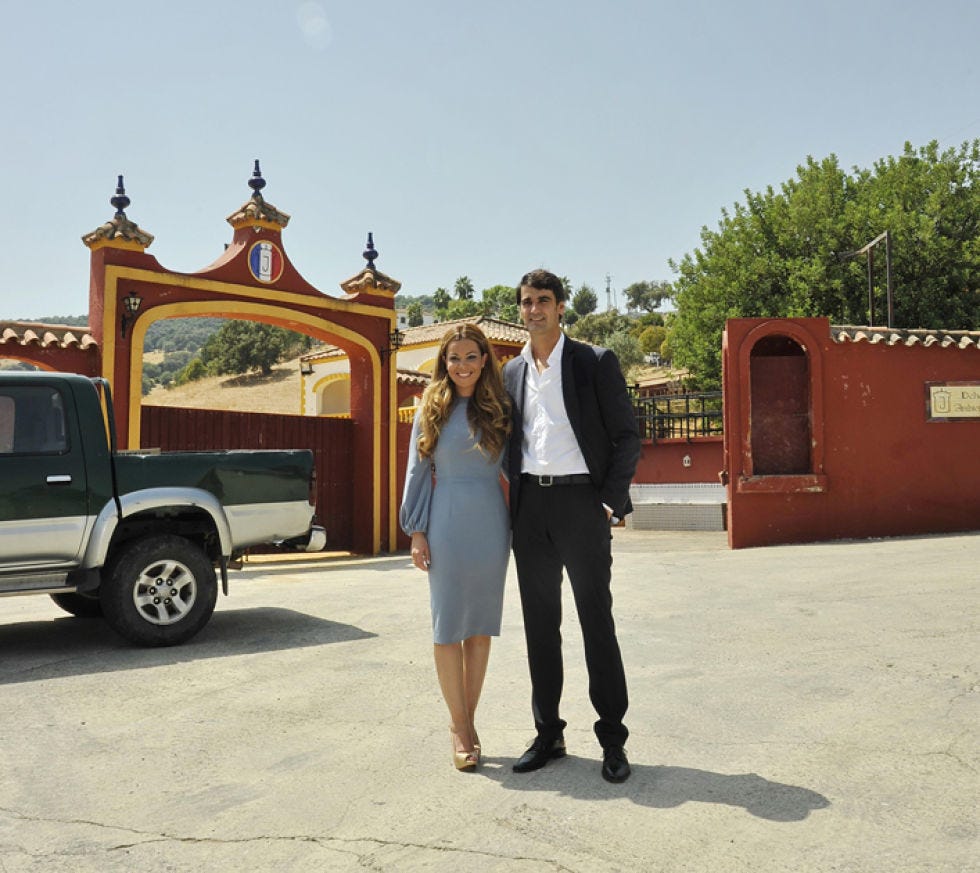 Trousers, Automotive tire, Coat, Dress, Standing, Outerwear, Automotive exterior, Fender, Suit, Auto part, 