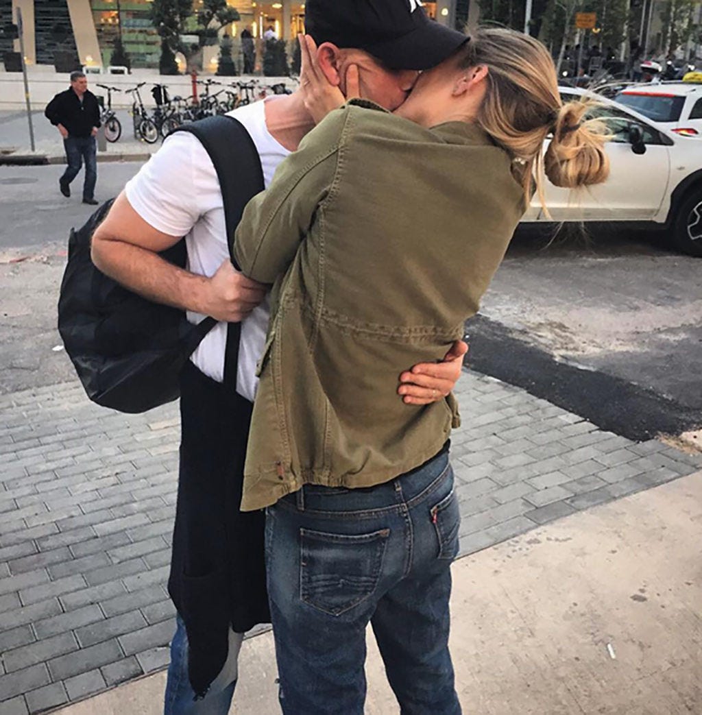 Cap, Trousers, Denim, Jeans, Outerwear, T-shirt, Interaction, Street fashion, Pocket, Baseball cap, 