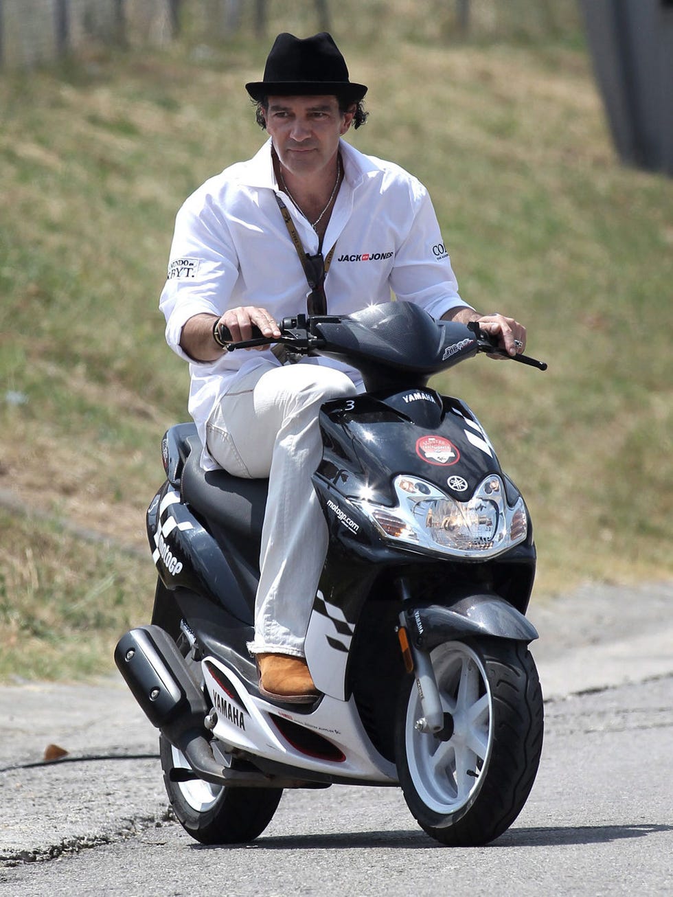 Tire, Automotive design, Scooter, Shoe, Hat, Automotive tire, Fender, Automotive wheel system, Asphalt, Headlamp, 