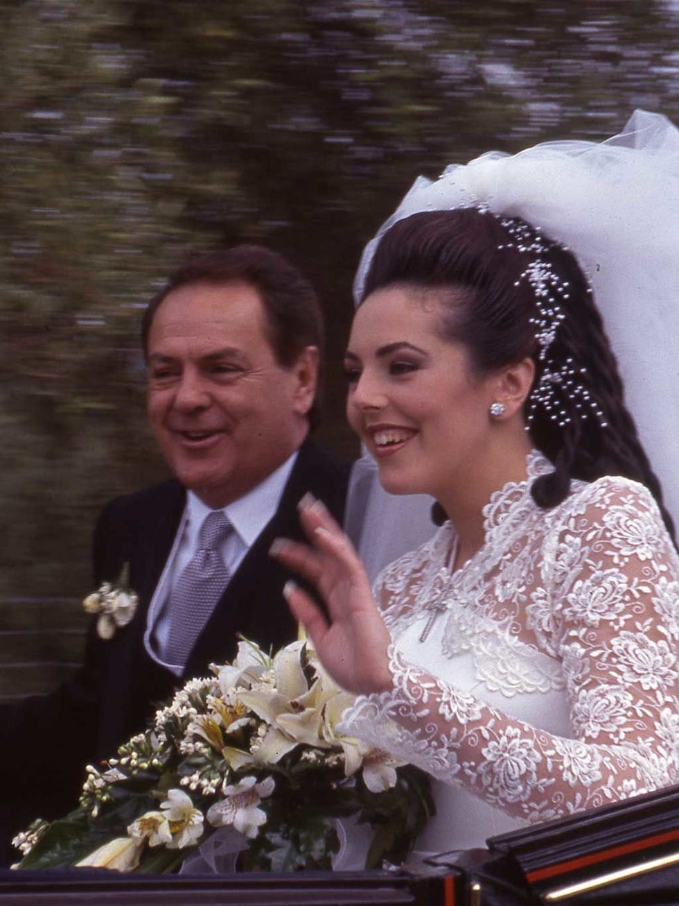 Clothing, Smile, Coat, Bridal veil, Photograph, Bridal clothing, Outerwear, Veil, Happy, Formal wear, 