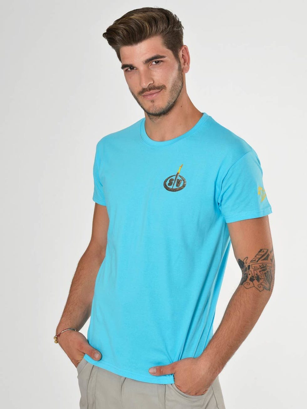 Arm, Blue, Sleeve, Human body, Shoulder, Elbow, Standing, Joint, Facial hair, Teal, 