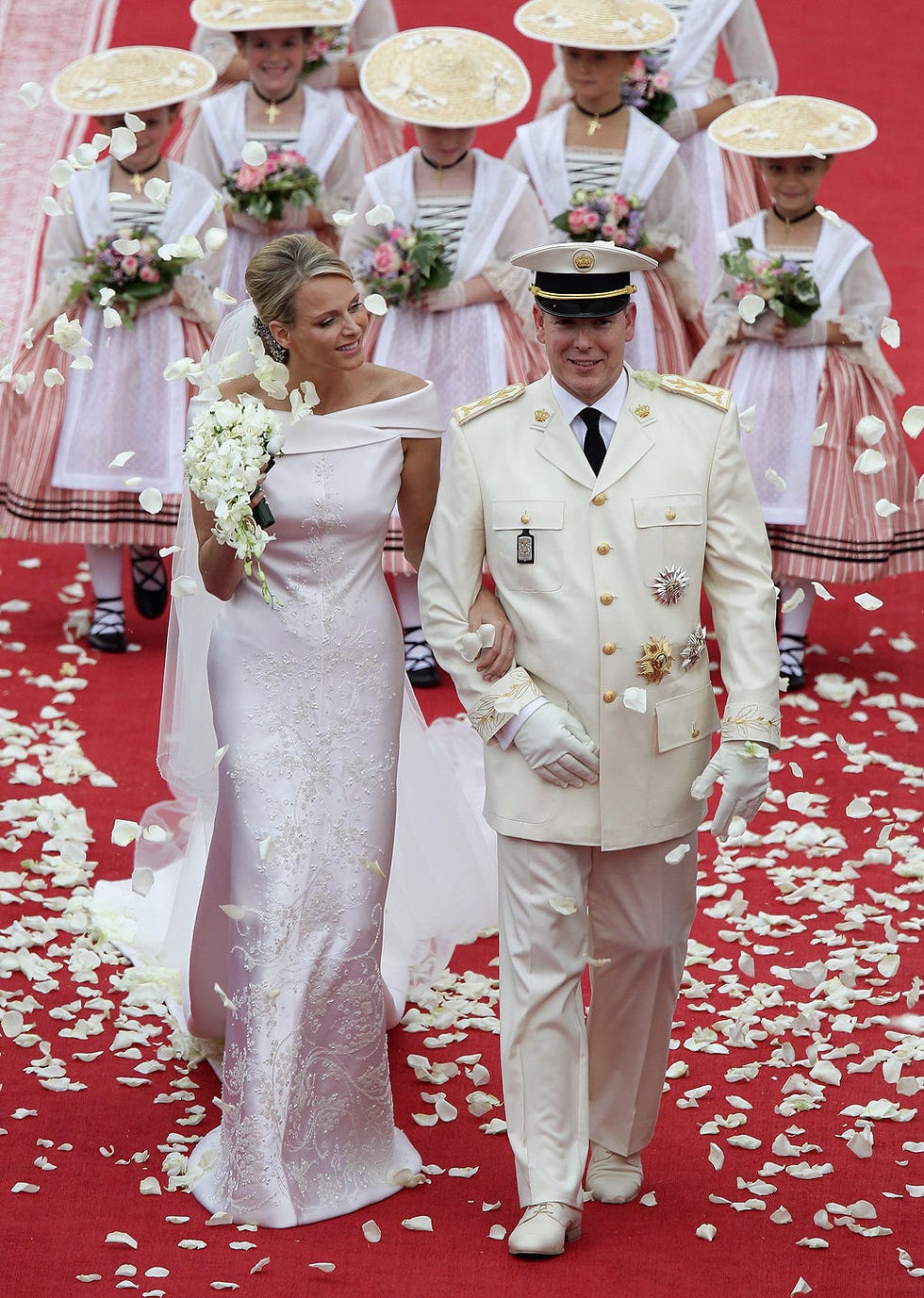 Hat, Event, Trousers, Red, Outerwear, Petal, Dress, Bridal clothing, Coat, Tradition, 