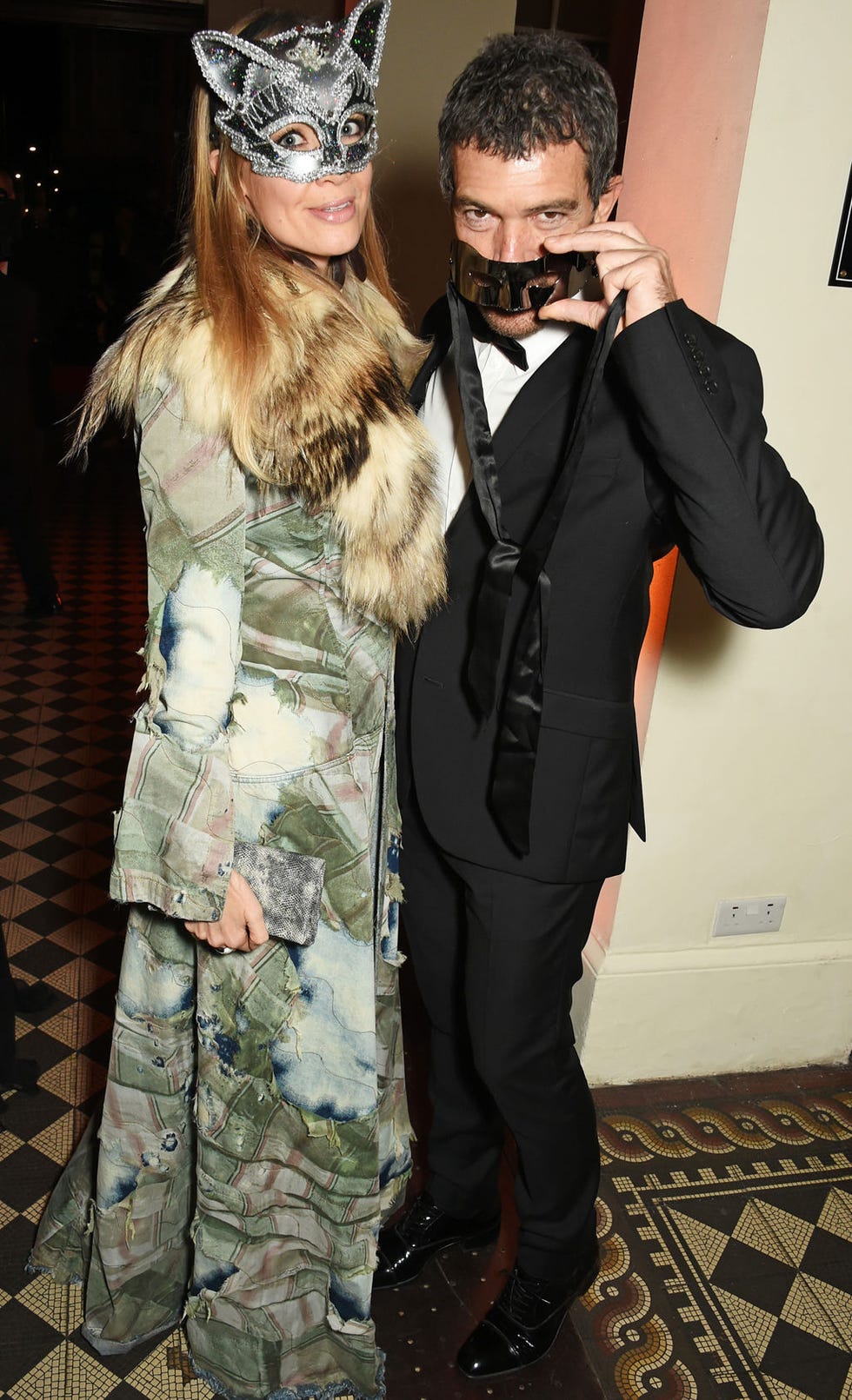 Camouflage, Military camouflage, Costume accessory, Costume, Costume design, Bow tie, Glove, Hair accessory, Headpiece, Facial hair, 