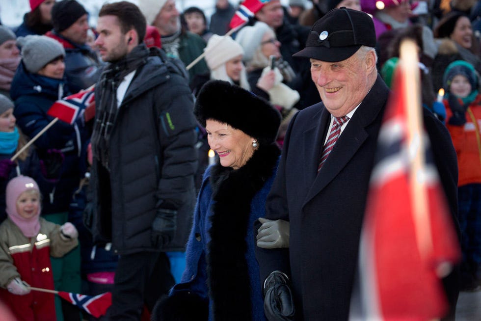 Face, Winter, Cap, Crowd, Flag, Tie, Baseball cap, Fan, Audience, Fur, 