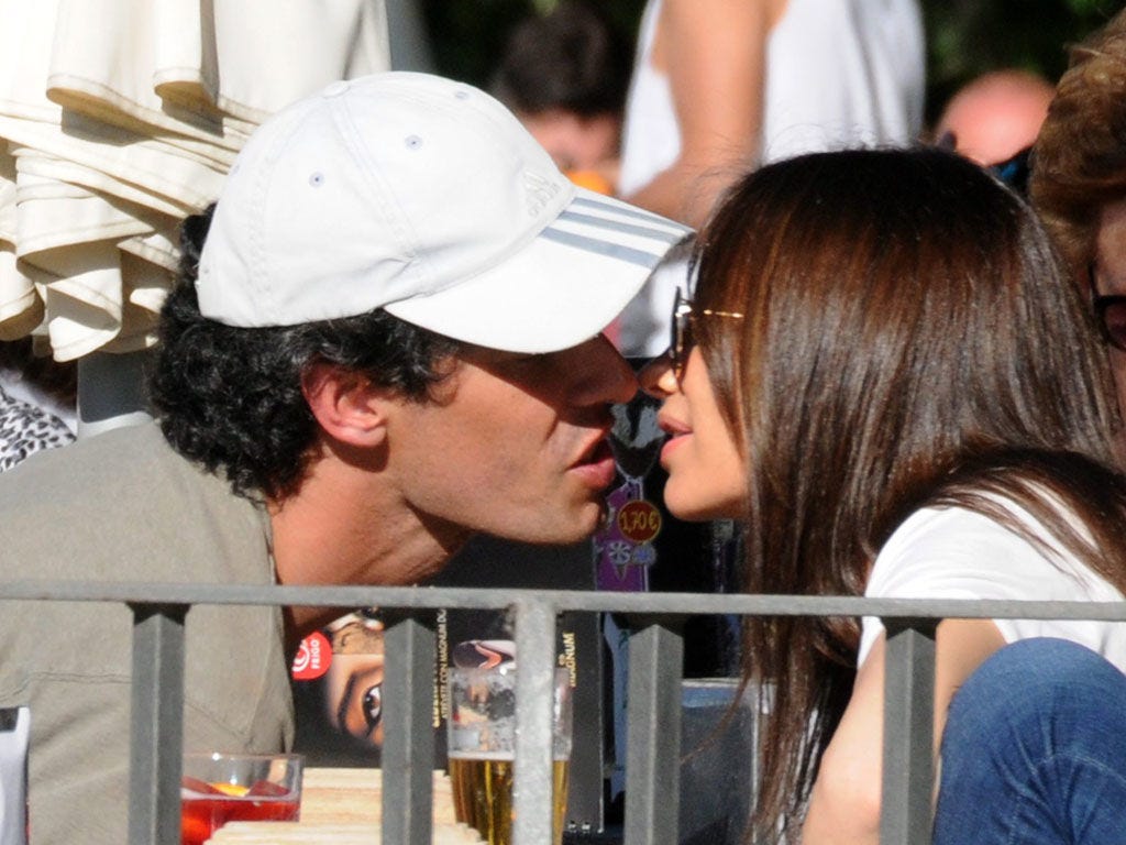 Cap, Interaction, Baseball cap, Drink, Love, Long hair, Cricket cap, Romance, Distilled beverage, Kiss, 
