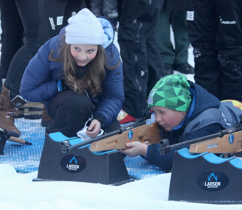 Winter, Recreation, Gun, Shooting, Outdoor recreation, Match rifle shooting, Shooting sport, Individual sports, Glove, Shotgun, 