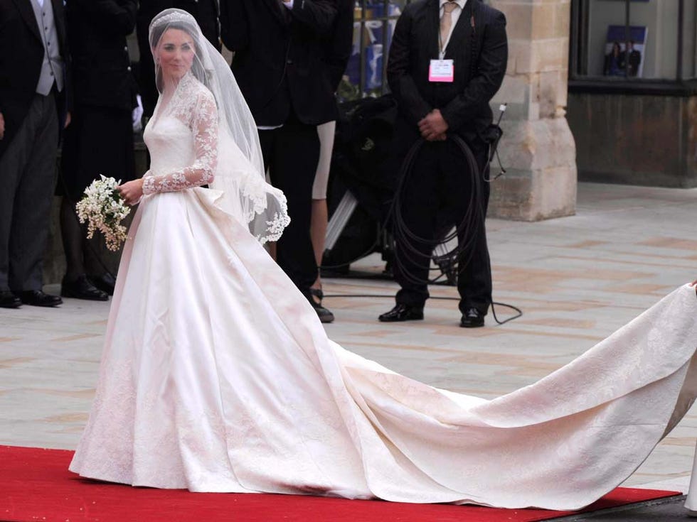 Clothing, Coat, Event, Trousers, Suit, Dress, Outerwear, Bridal veil, Formal wear, Flooring, 