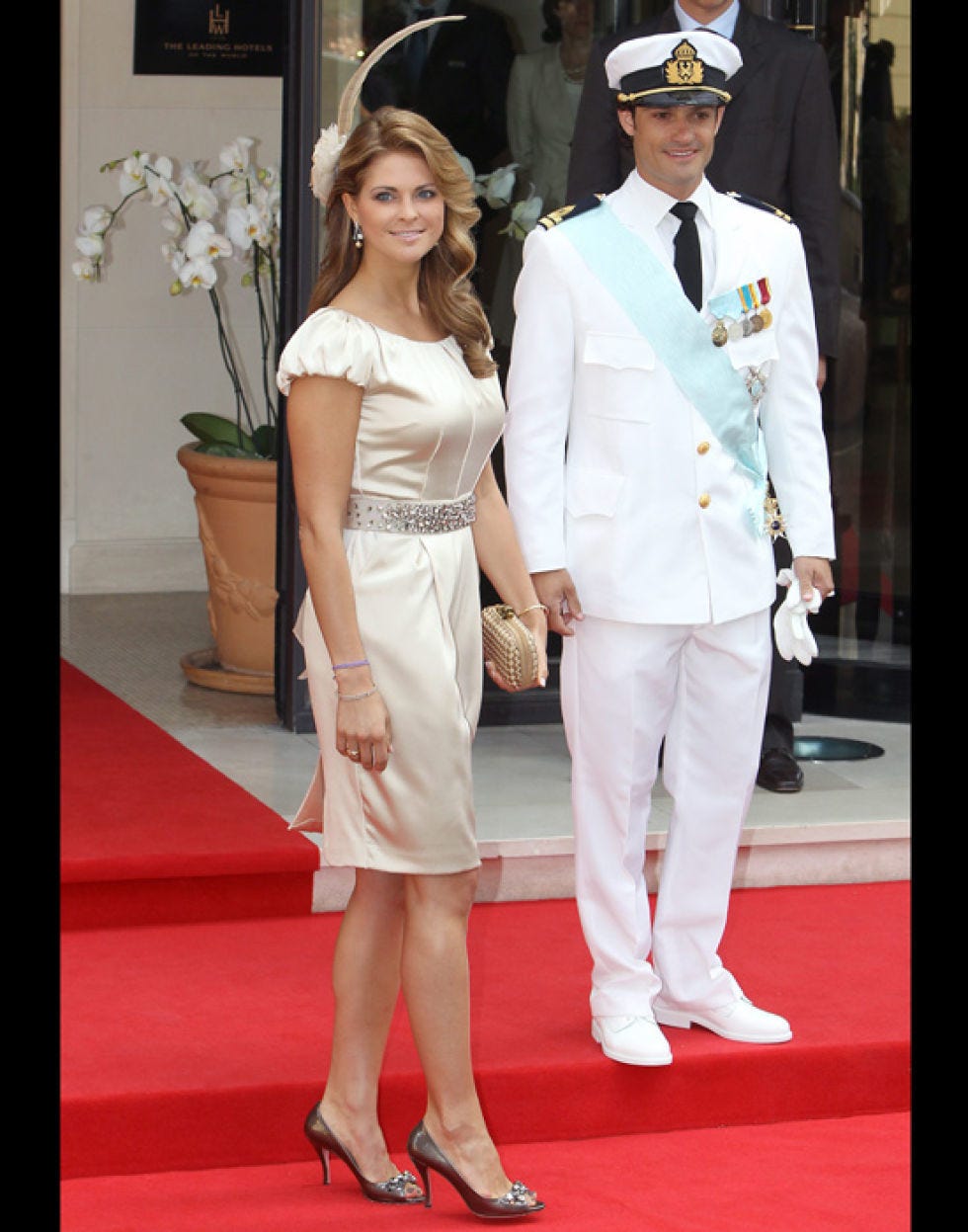 Clothing, Hat, Trousers, Flooring, Dress, Shirt, Outerwear, Coat, Formal wear, Style, 