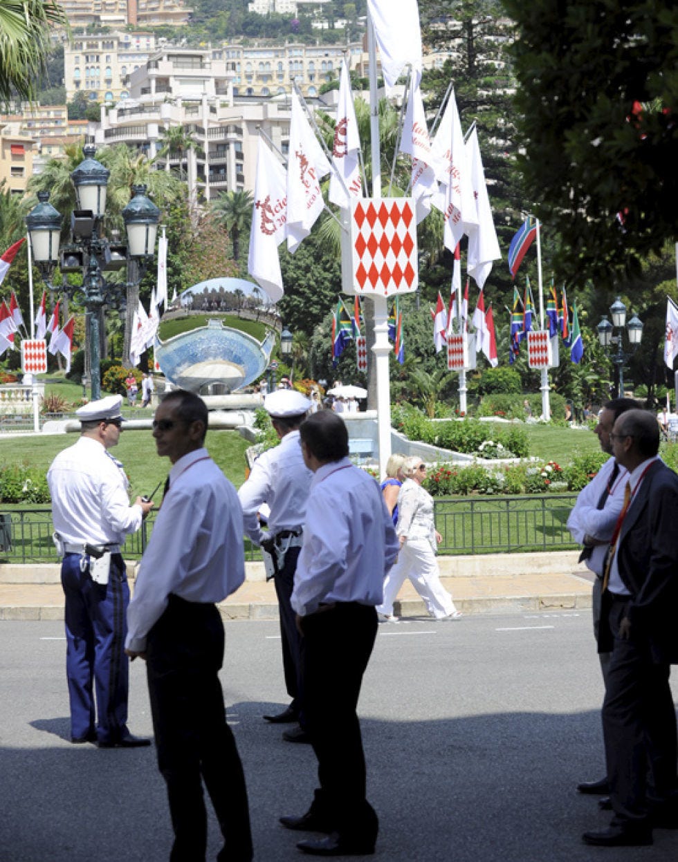 Footwear, Flag, Pole, Pedestrian, Flag of the united states, Walking, Official, Suit trousers, Palm tree, 