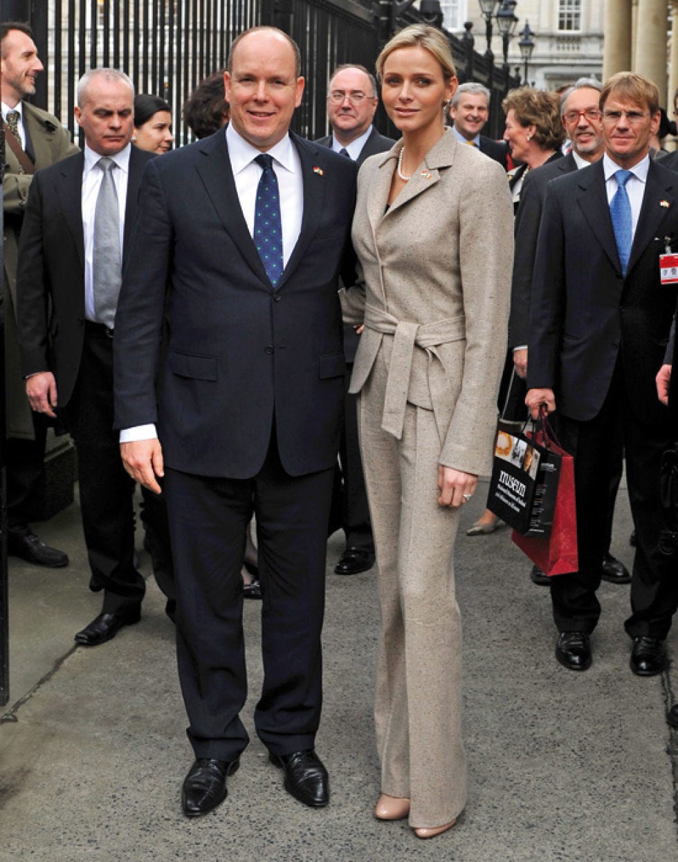 Clothing, Footwear, Coat, Dress shirt, Trousers, Collar, Suit trousers, Shirt, Suit, Standing, 