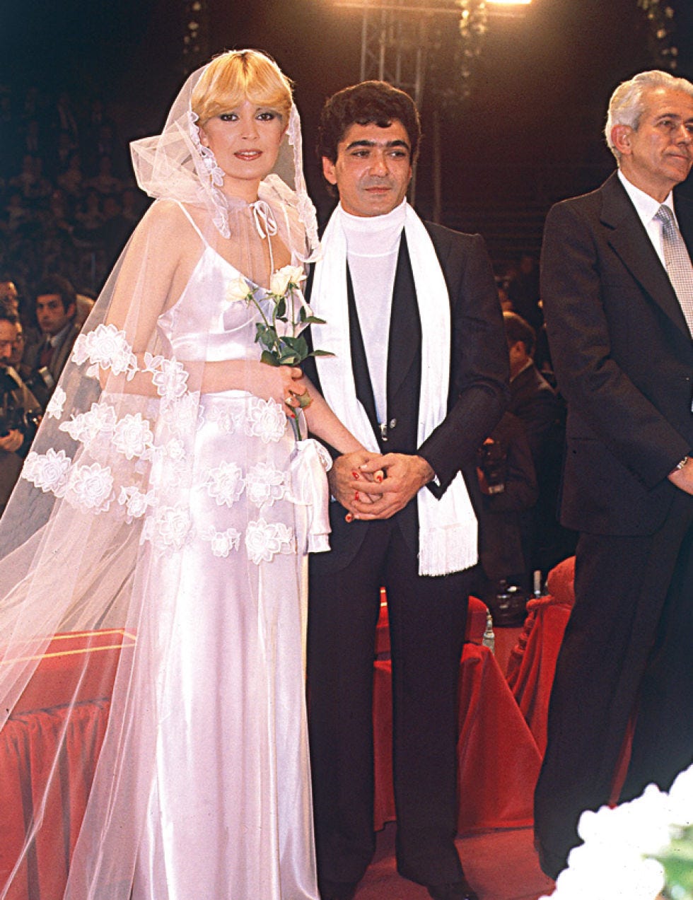 Clothing, Coat, Event, Trousers, Shirt, Textile, Outerwear, Suit, Formal wear, Veil, 