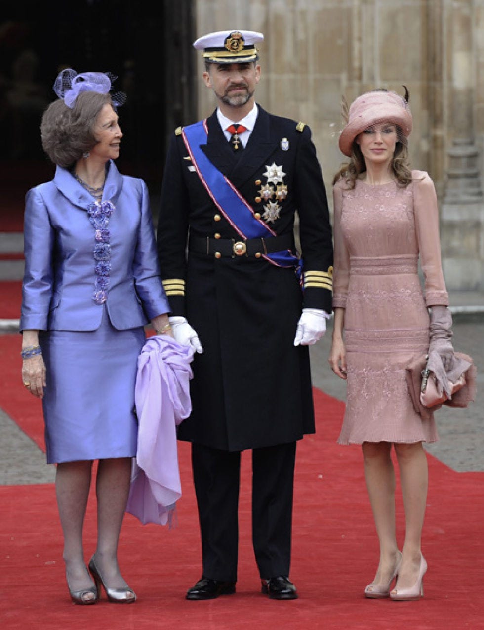 Trousers, Hat, Coat, Outerwear, Fashion accessory, Interaction, Headgear, Dress, Fashion, Carpet, 