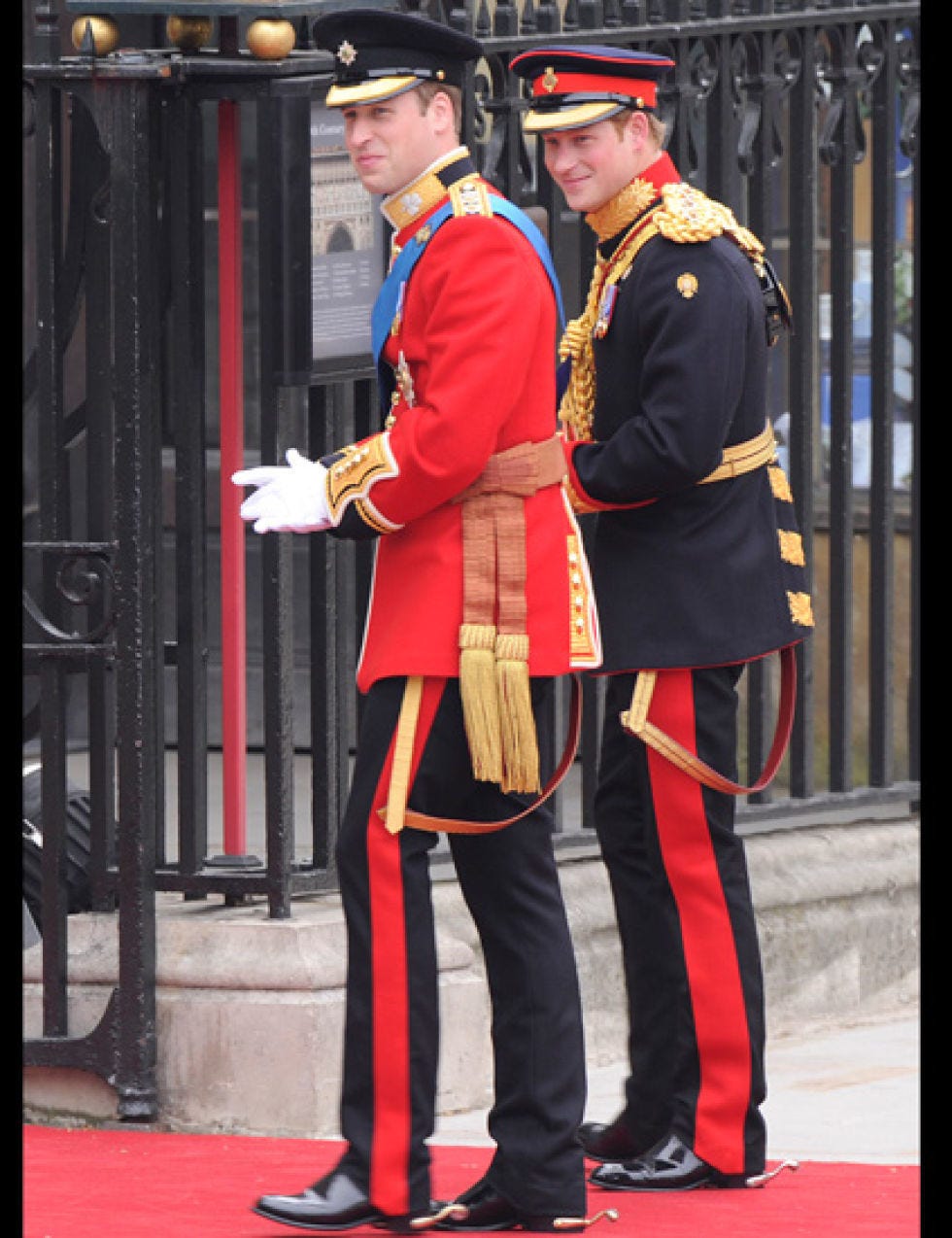 Standing, Hat, Uniform, Headgear, Suit trousers, Carpet, Costume accessory, Military uniform, Peaked cap, Non-commissioned officer, 