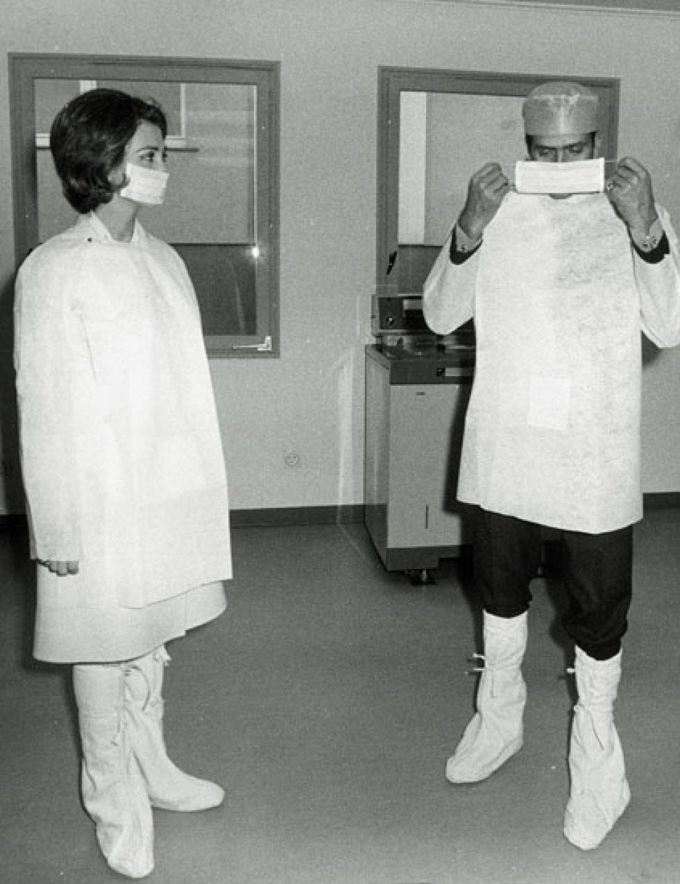 Standing, Uniform, White coat, Sock, Vintage clothing, Overcoat, 