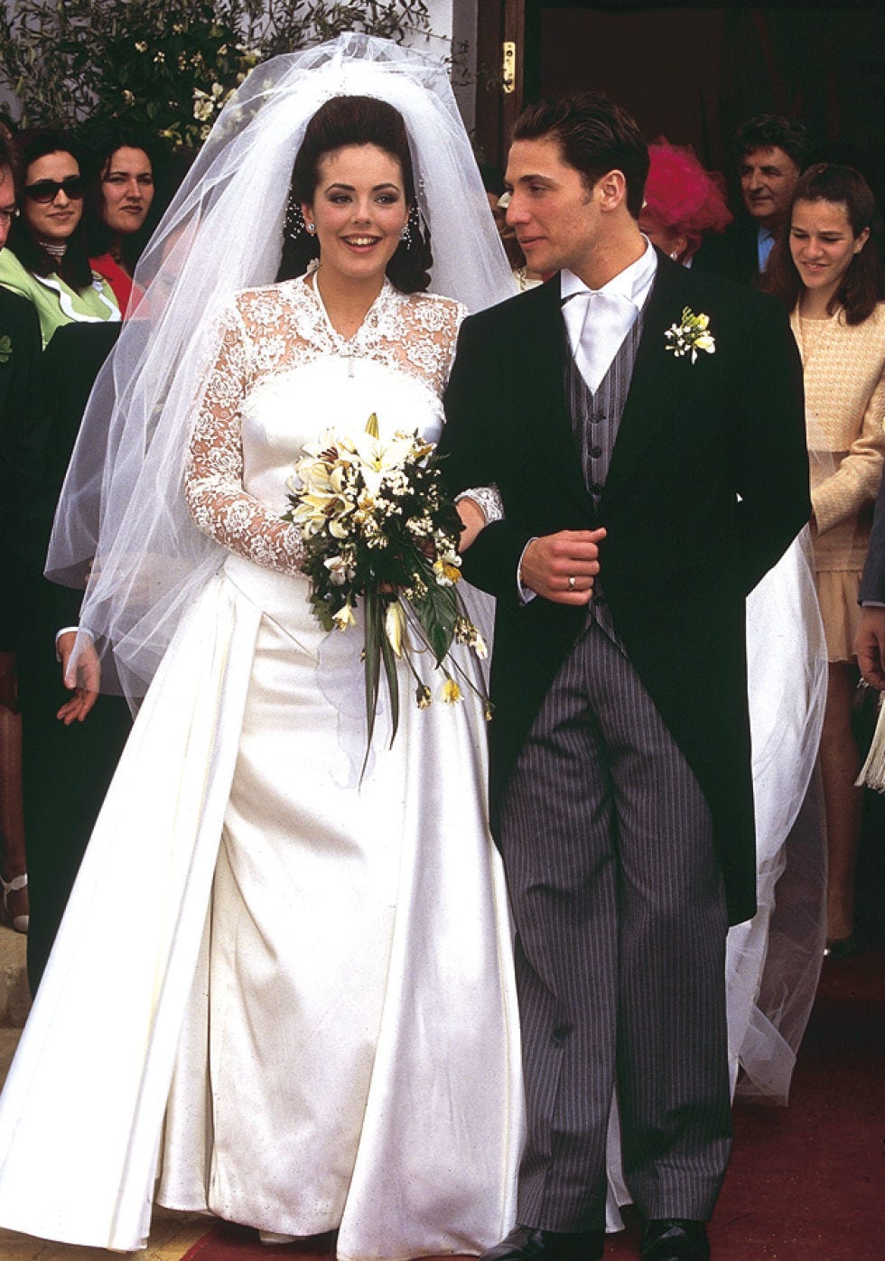 Clothing, Dress, Coat, Event, Bridal veil, Bridal clothing, Trousers, Shoe, Veil, Photograph, 