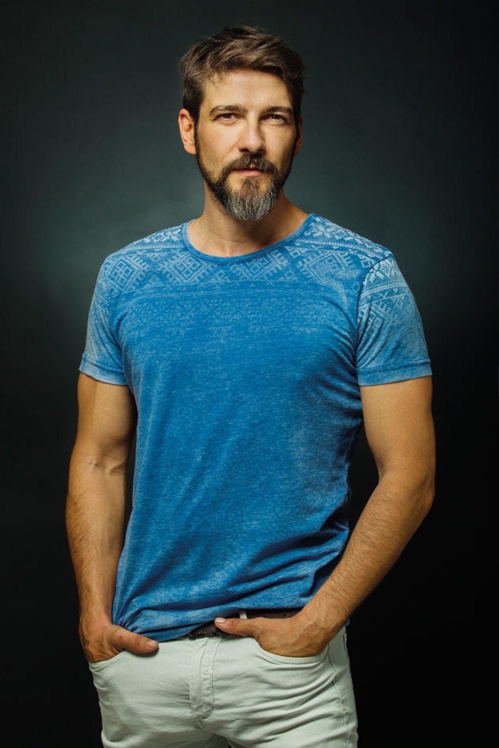 Blue, Cheek, Facial hair, Sleeve, Shoulder, Elbow, Standing, Joint, Beard, Chest, 