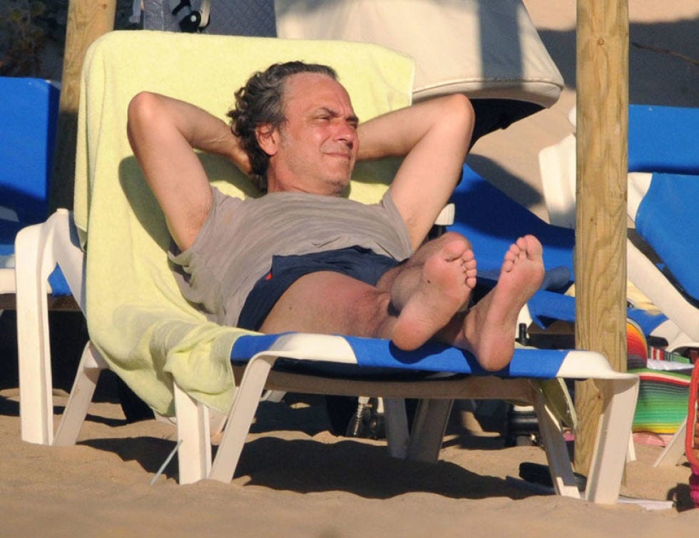 Comfort, Sitting, Barefoot, Sunlounger, Lap, Toe, Foot, Outdoor furniture, Trunks, Barechested, 