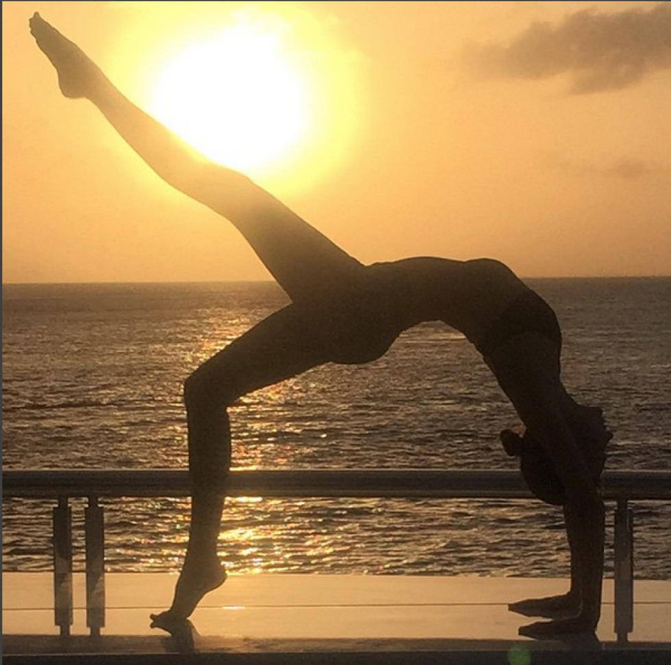 Physical fitness, Sky, Yoga, Horizon, Sculpture, Morning, Stretching, Water, Sea, Leg, 